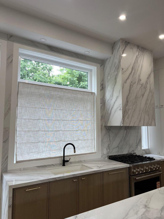 Custom faux linen relaxed Roman shade with flat folds in Vanilla, cordless, light filtering — LOGANOVA