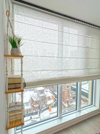 Brent sheer linen relaxed Roman shade with a soft curved hem, inside-mounted on a bright window — LOGANOVA