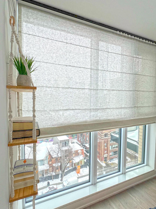 Brent sheer linen relaxed Roman shade with a soft curved hem, inside-mounted on a bright window — LOGANOVA