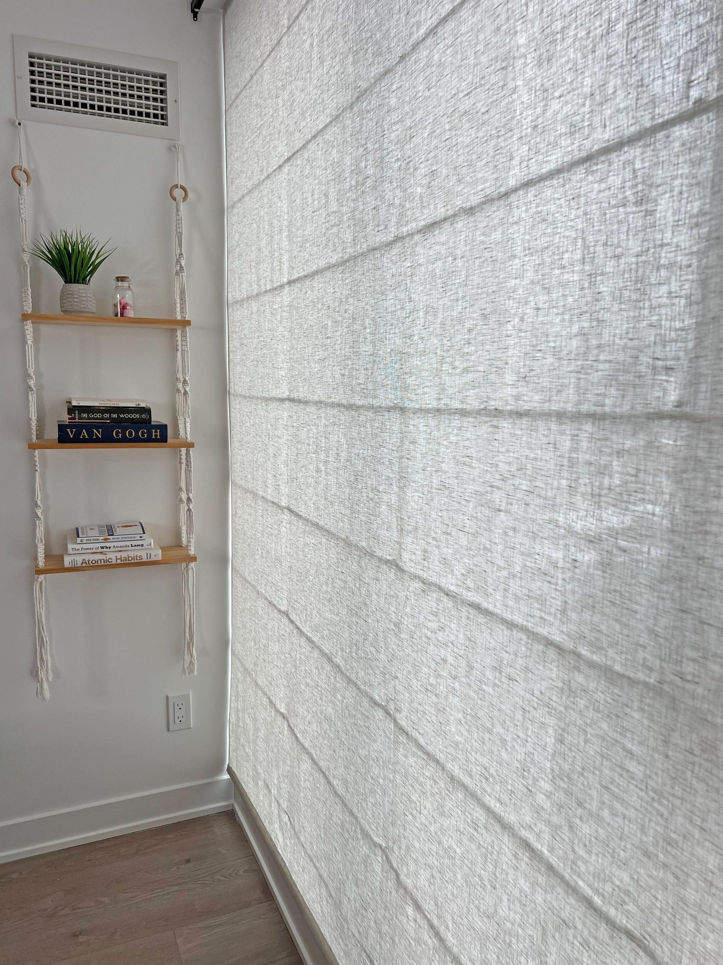 Brent linen Roman shade in a bright dining nook with the relaxed curved hem — LOGANOVA