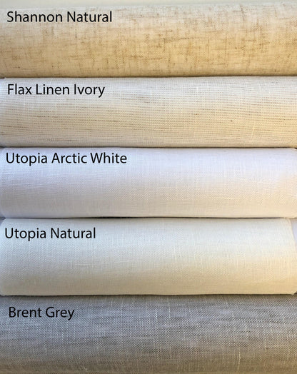 Natural linen fabric sample rolls for custom Roman shades and curtains: Shannon Natural, Flax Linen Ivory, Utopia Arctic White, Utopia Natural and Brent Grey woven fabrics.
