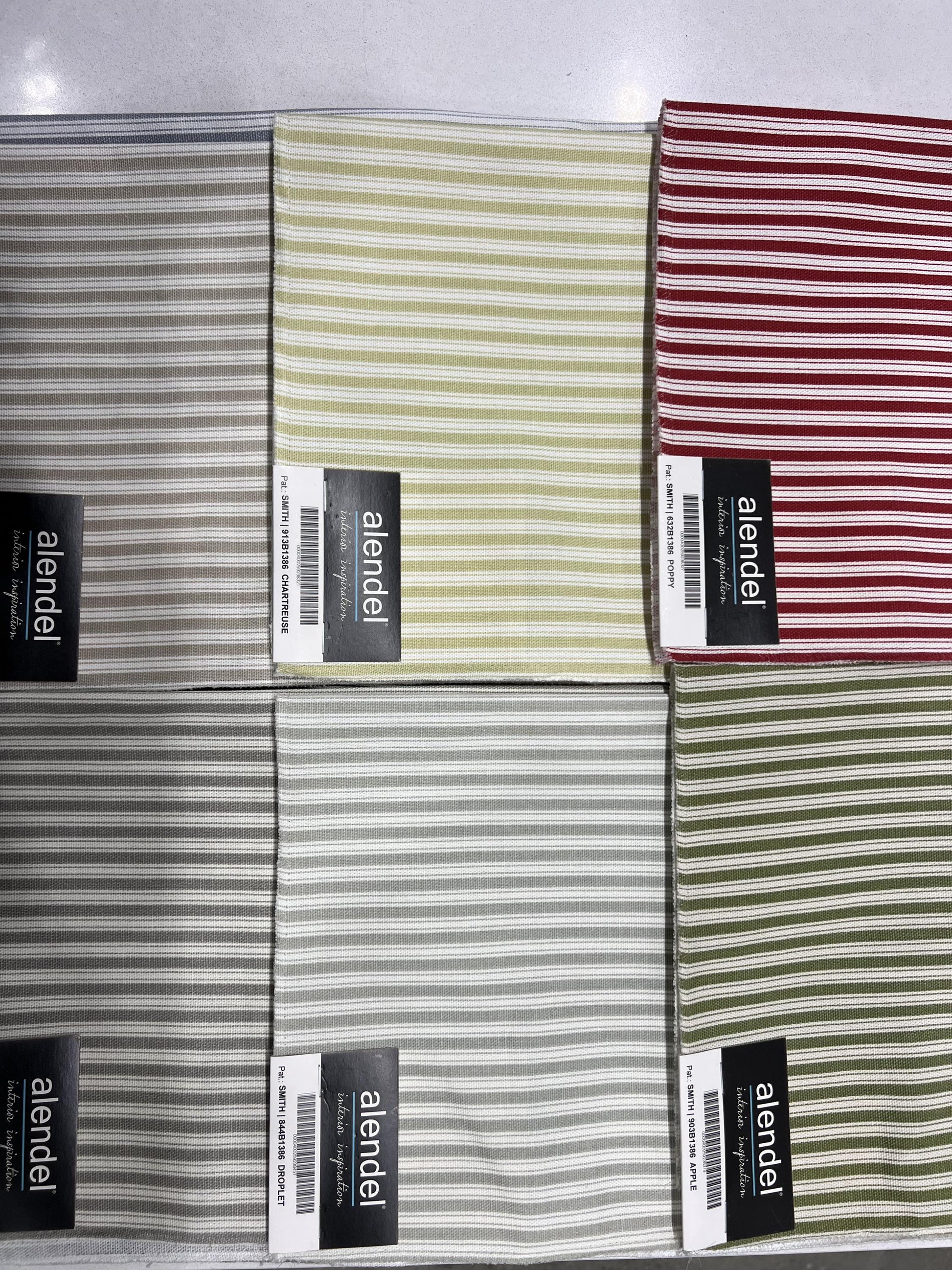 Ticking stripe cotton fabric swatches in green, cream and red from the Alendel Smith range.