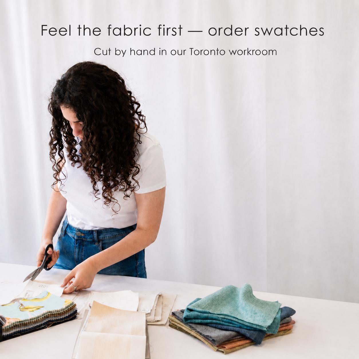 Cutting linen fabric swatches by hand in the LOGANOVA Toronto workroom