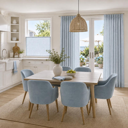 Sky faux linen cafe curtain beside a breakfast table showing panel scale on a full window
