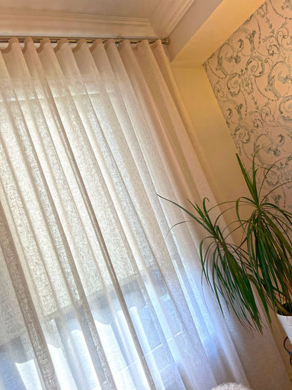Brent Candle ripple fold sheer curtains on a track across a sunlit window, soft even folds full length