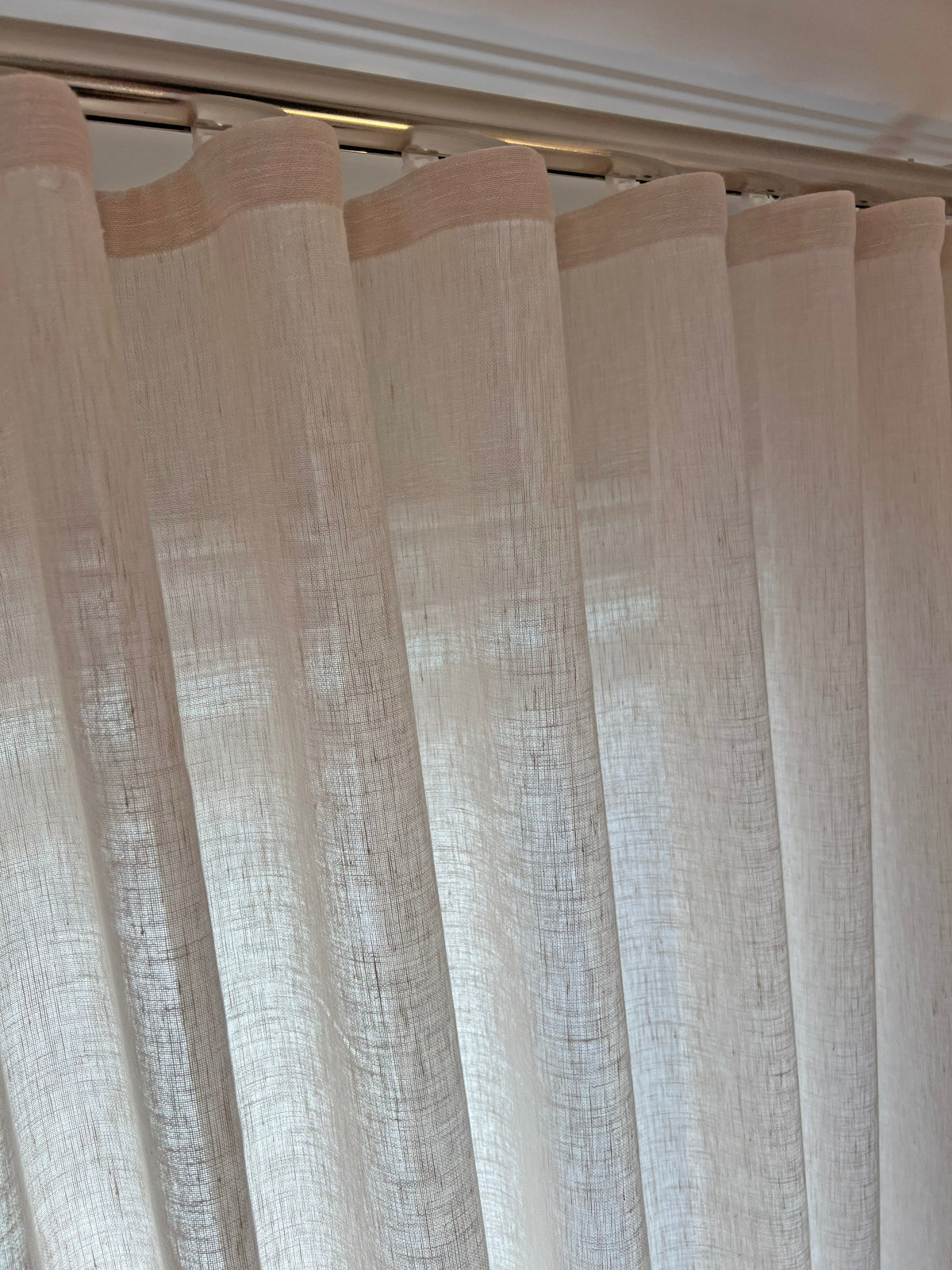 Close-up of the snap tape header on a Brent Candle ripple fold sheer, folds clipped evenly along the track