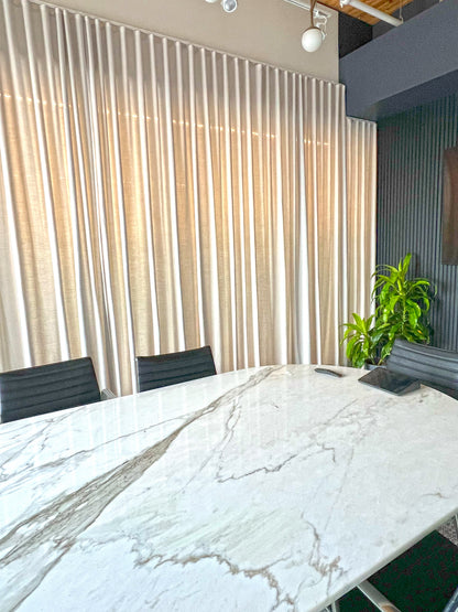 Far Cloud drapery panel with daylight behind it, showing how the opaque weave filters light