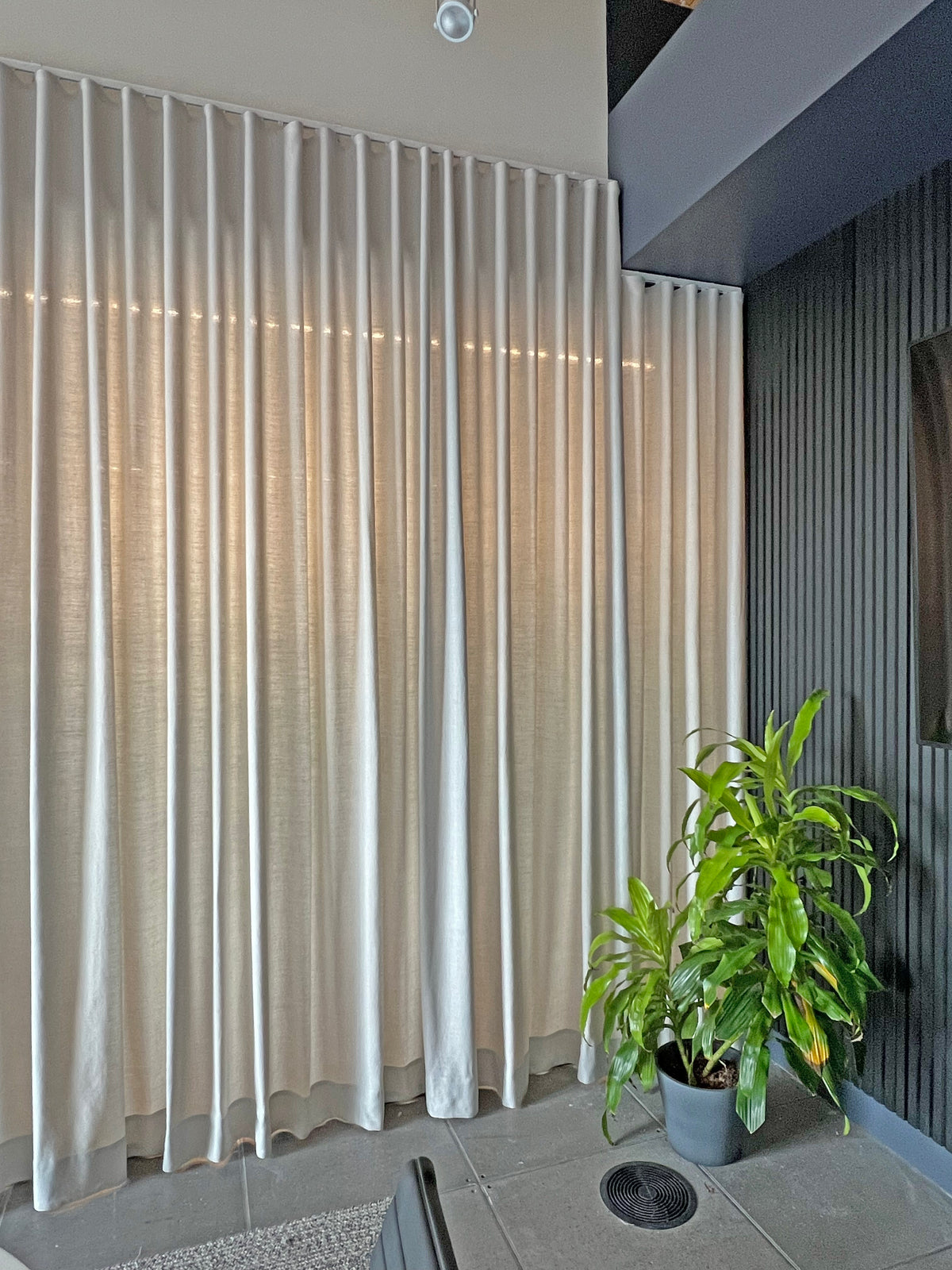 Far Cloud ripple fold panel stacked open at the side of a window on a square track
