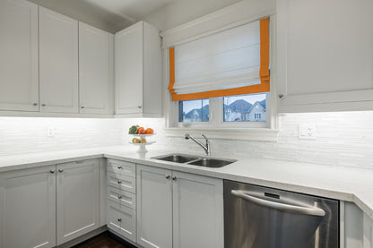 White flat Roman shade with Mango border