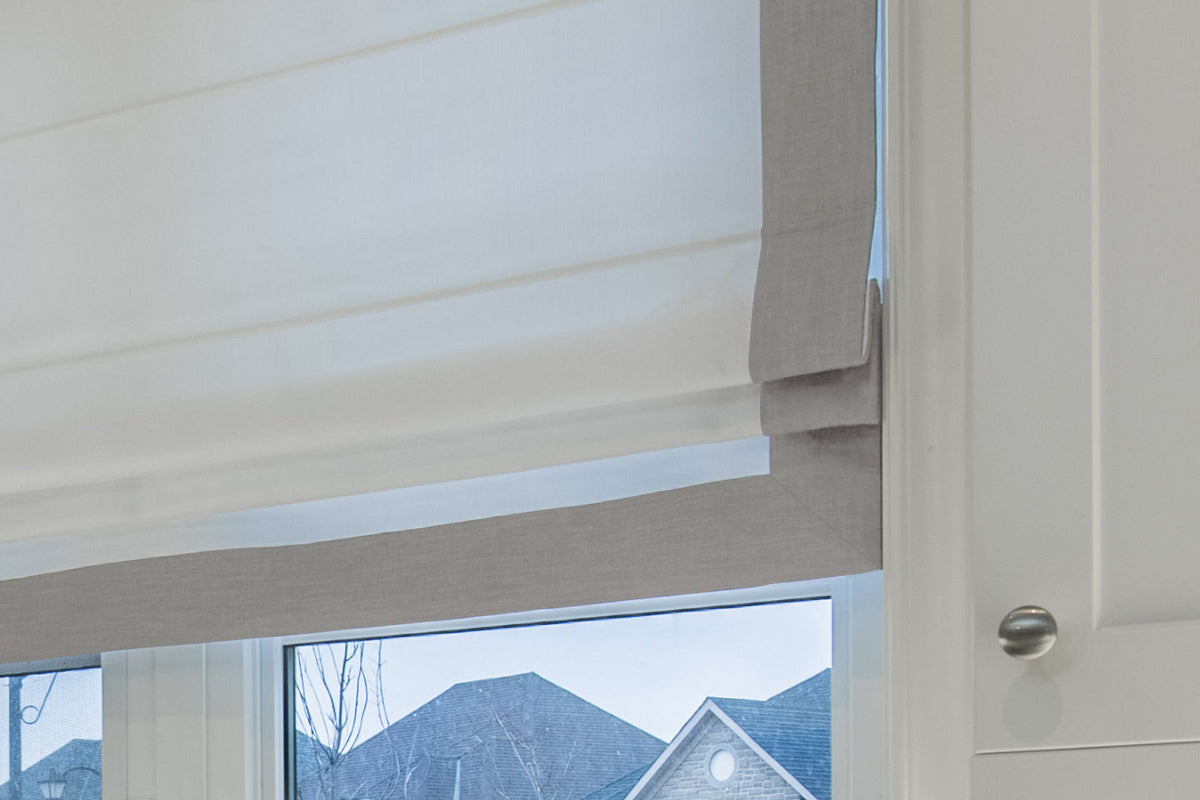 White flat Roman shade with Silver border