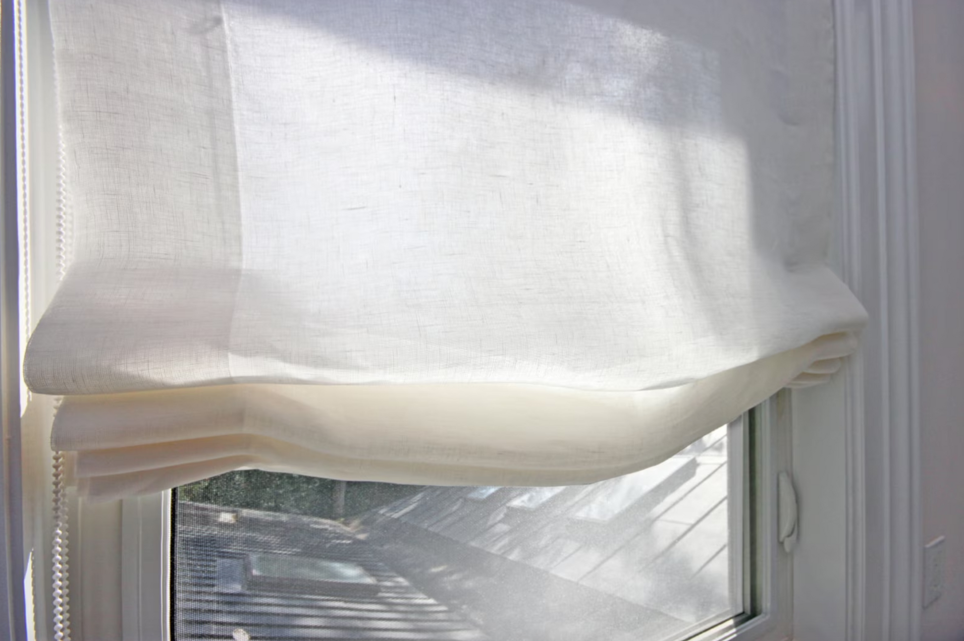 Sheer linen Roman shade in interior